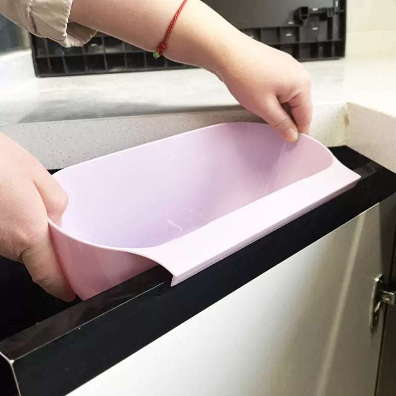 Pink colour Trash Bin Hanging On Cupboard